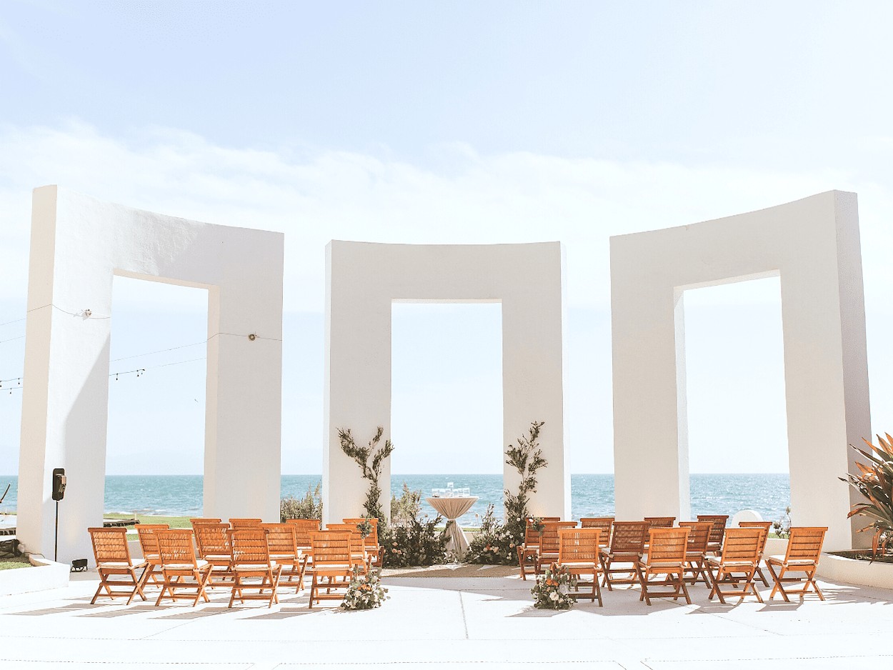 Ceremony site with white arches facing the ocean at Grand Velas Riviera Nayarit